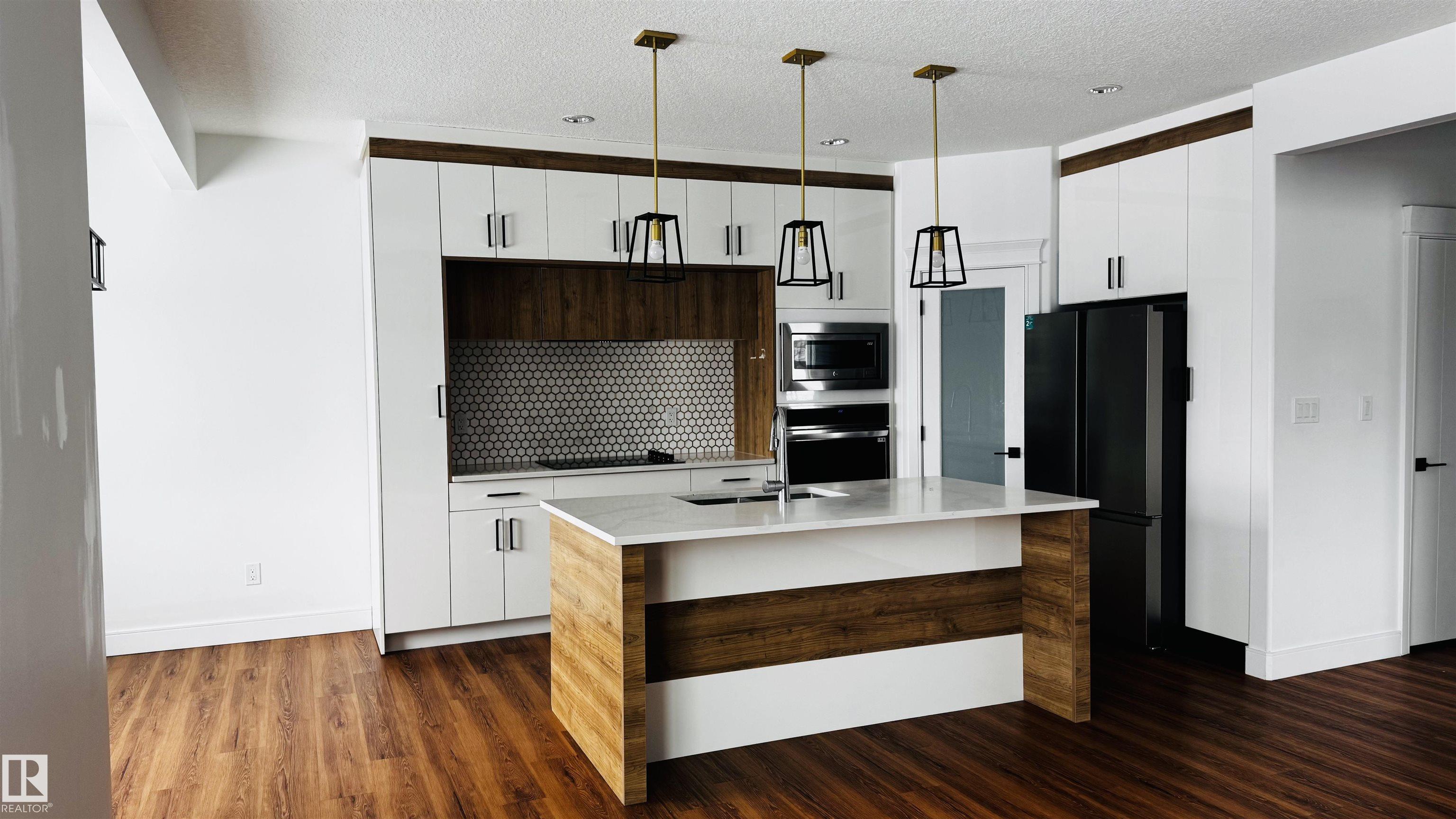 Photo 7 at 1703 152 Avenue NW, Fraser, Edmonton