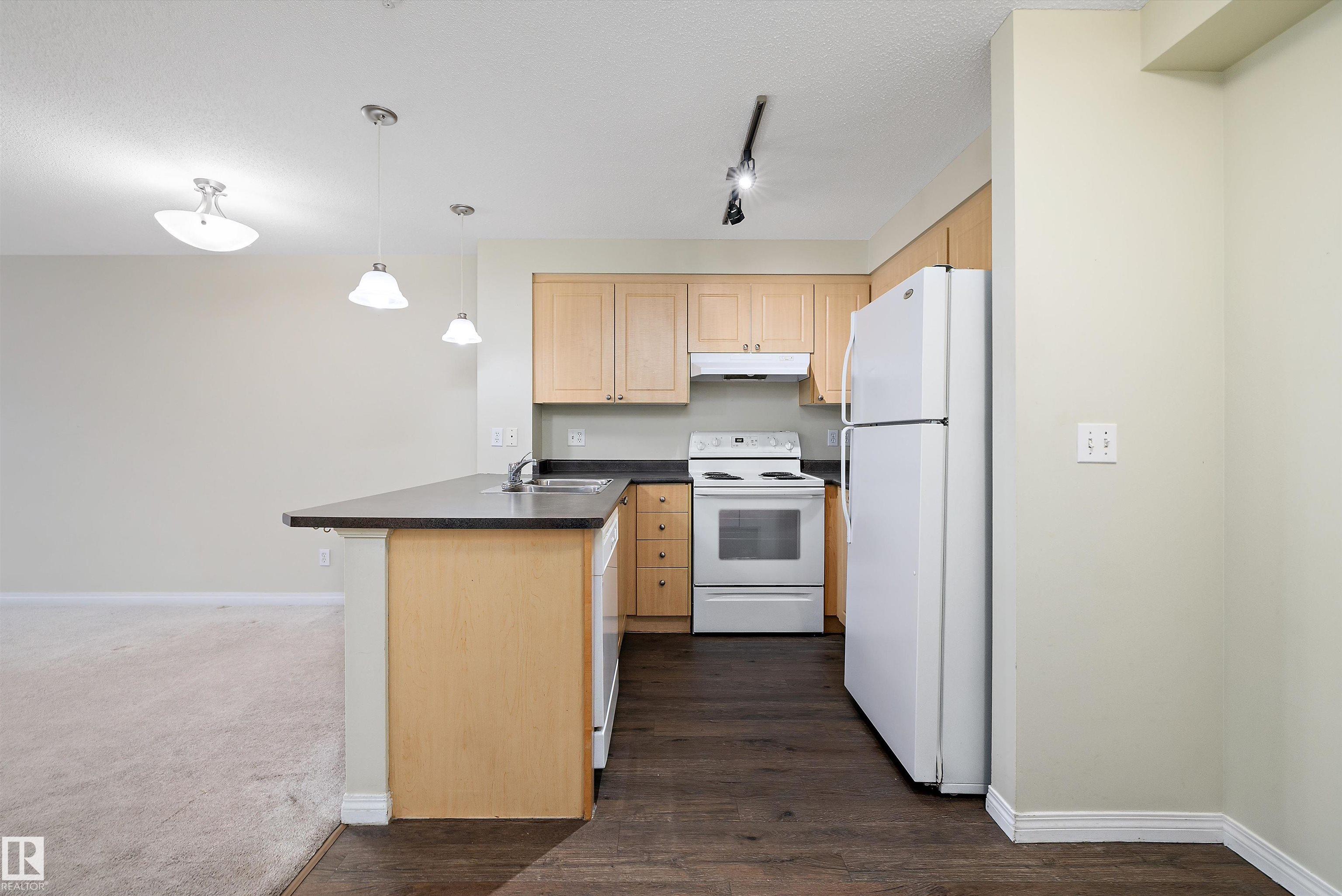 Photo 2 at 213 - 636 Mcallister Loop SW, Macewan, Edmonton