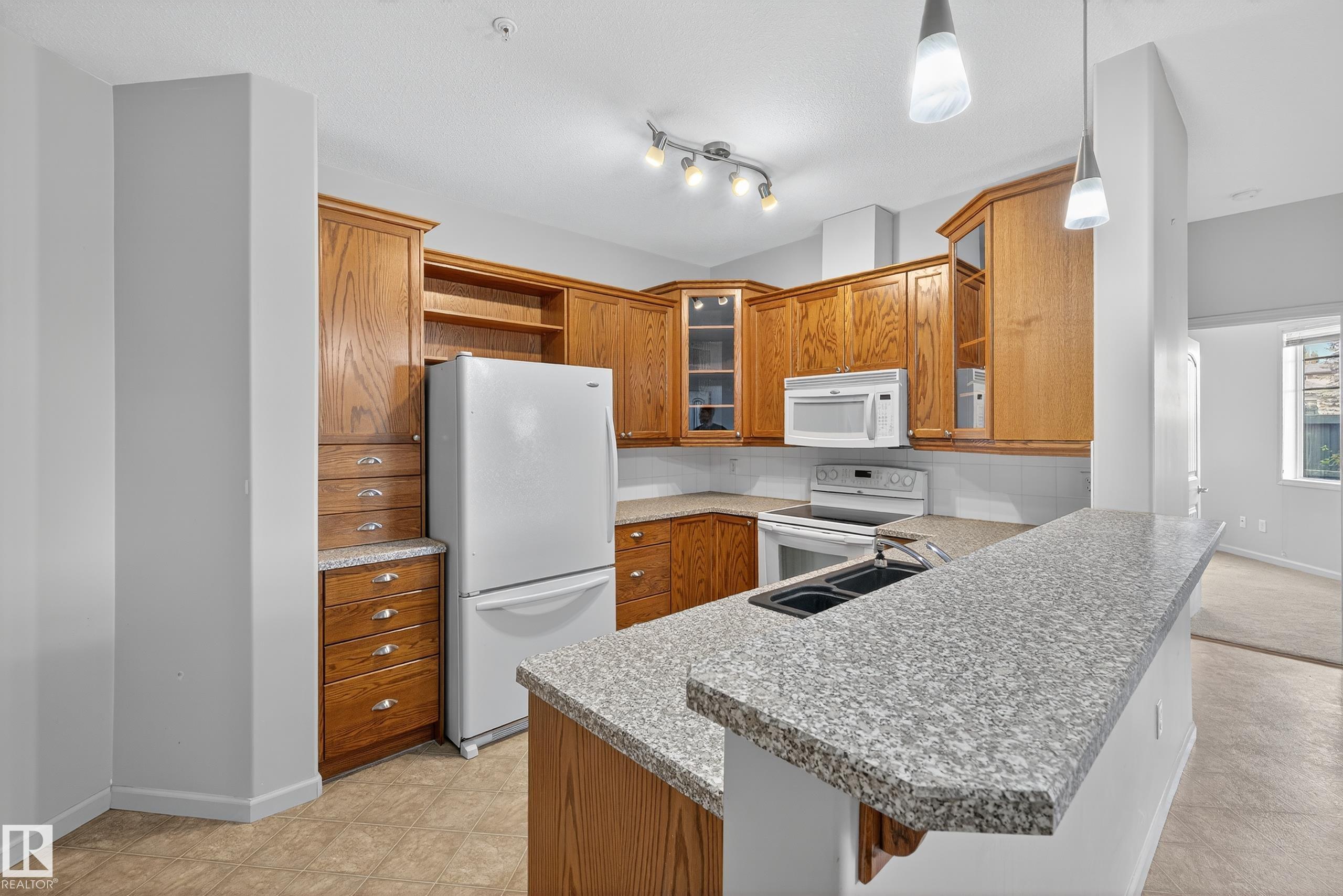 Photo 3 at 112 - 2503 Hanna Crescent NW, Haddow, Edmonton