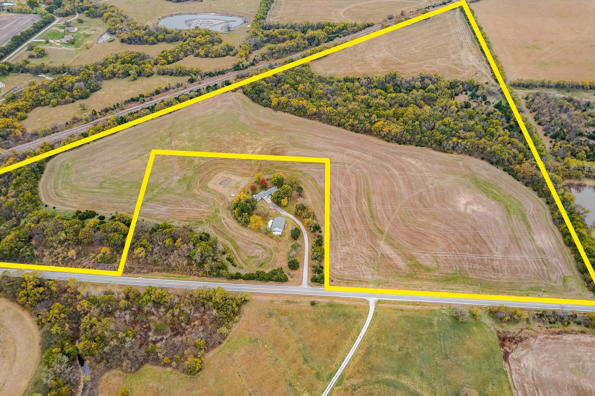 60+ beautiful acres just outside of Rose Hill, on the blacktop to Derby. 38+- tillable acres, the re