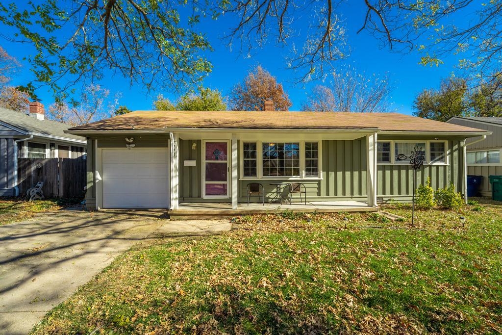 Beautifully updated home with sunroom attached with original hardwood floors, updated lighting, and 