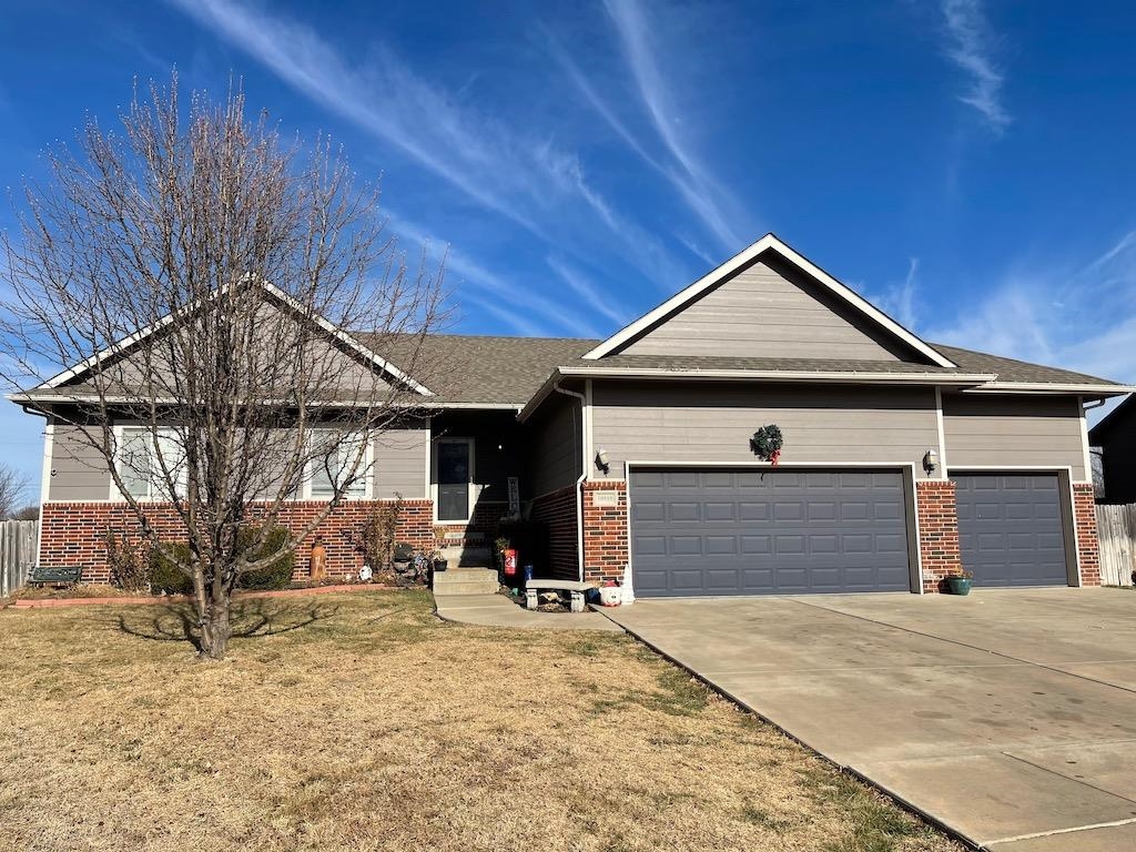 Large 5BR 3BA home in Goddard School District. Kitchen and dining are open to one another separated 