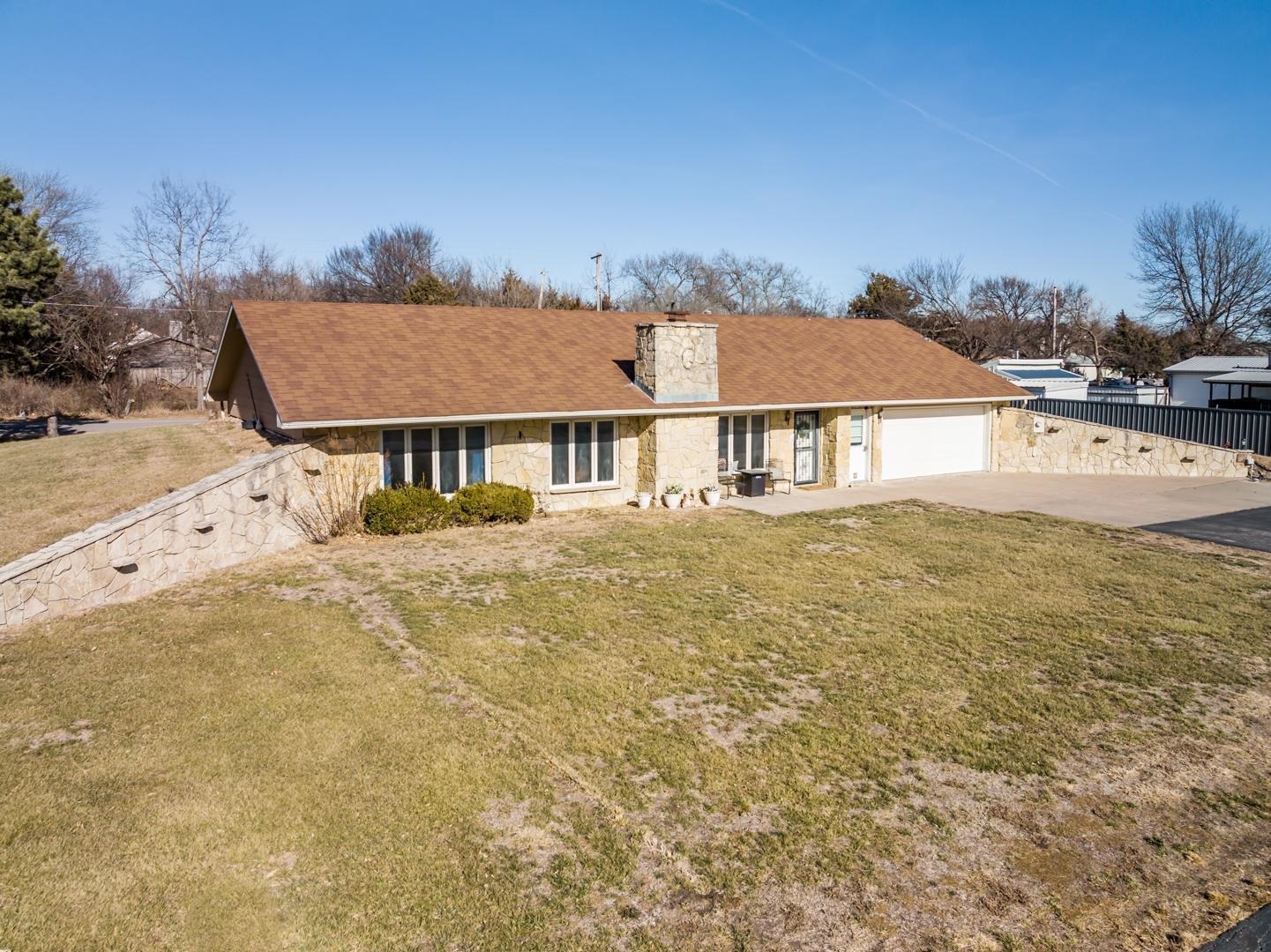So many possibilities with this home on 1.3 Acres on the edge of Benton.  2 Bed 2 Bath, 1895 sq. ft. Open floor plan, Main Floor Laundry, oversized 2 car Garage.  This is a Berm home, energy efficient earth home, located on 1.3 acres. New Appliances in Kitchen, eating bar. Woodburning Fireplace in Living Room.  Sprinkler System.  Cedar Walk-in closet.  Spa tub. Located just north of Stearman Airfield in Benton.  Seller has not lived in home, selling "as is" condition.