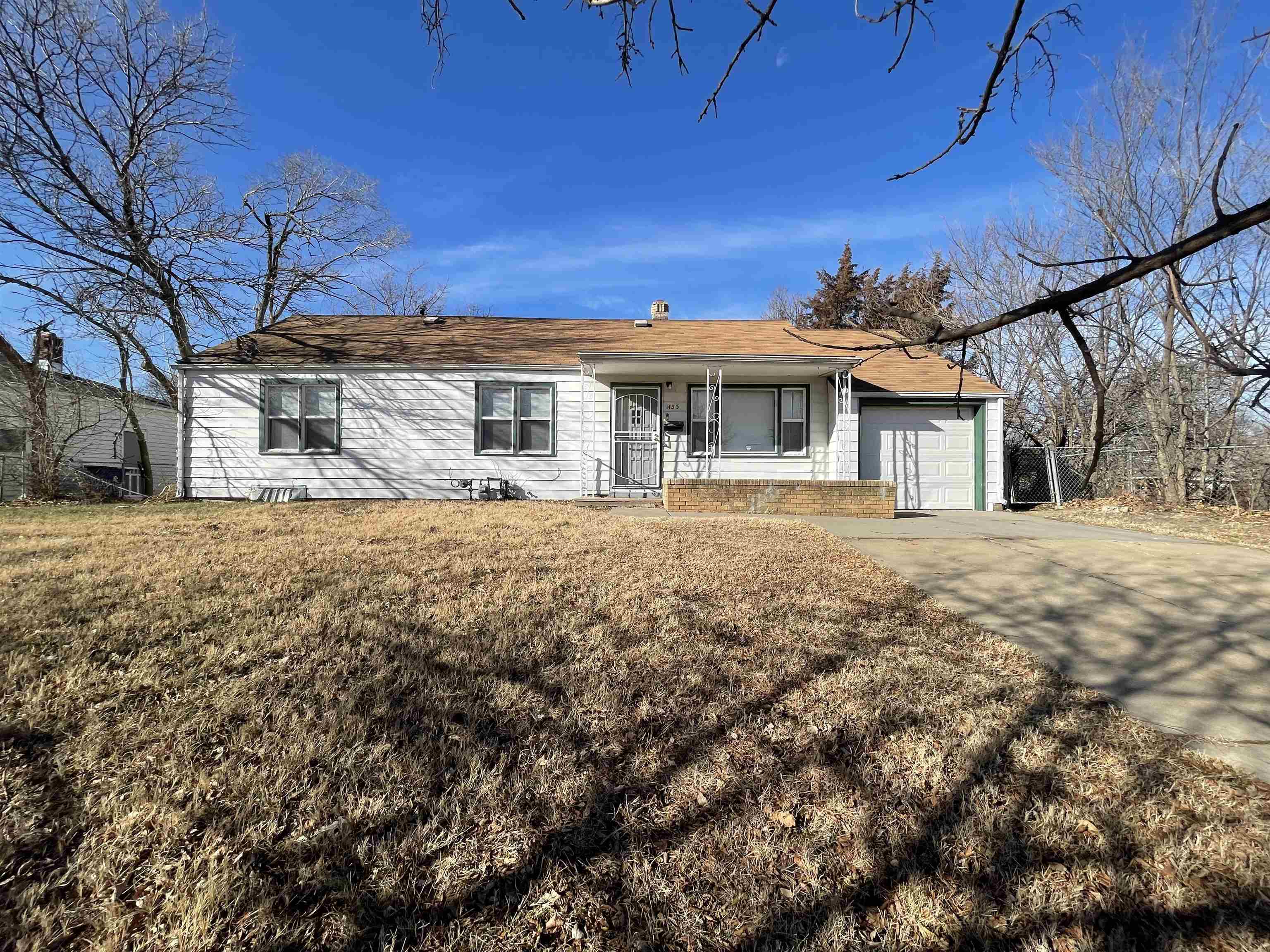 This ranch style home is Move in Ready! This home sits on a large corner lot on a hill. It features 