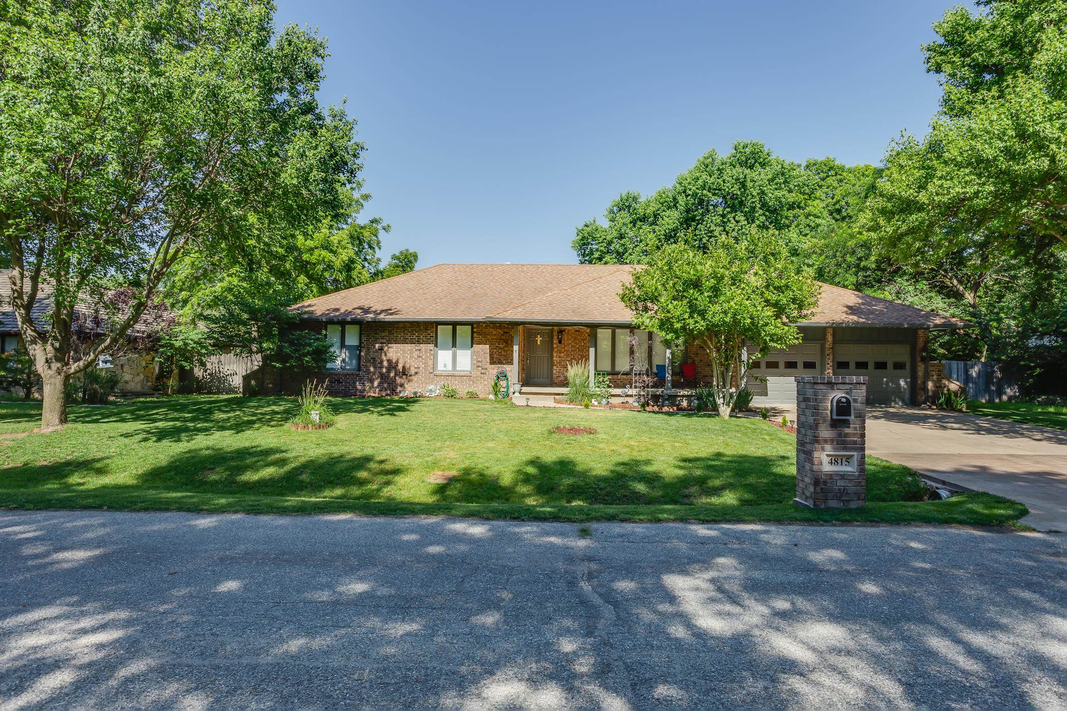 Beautiful sprawling brick ranch in a quiet neighborhood north of Wichita. The attention to detail in