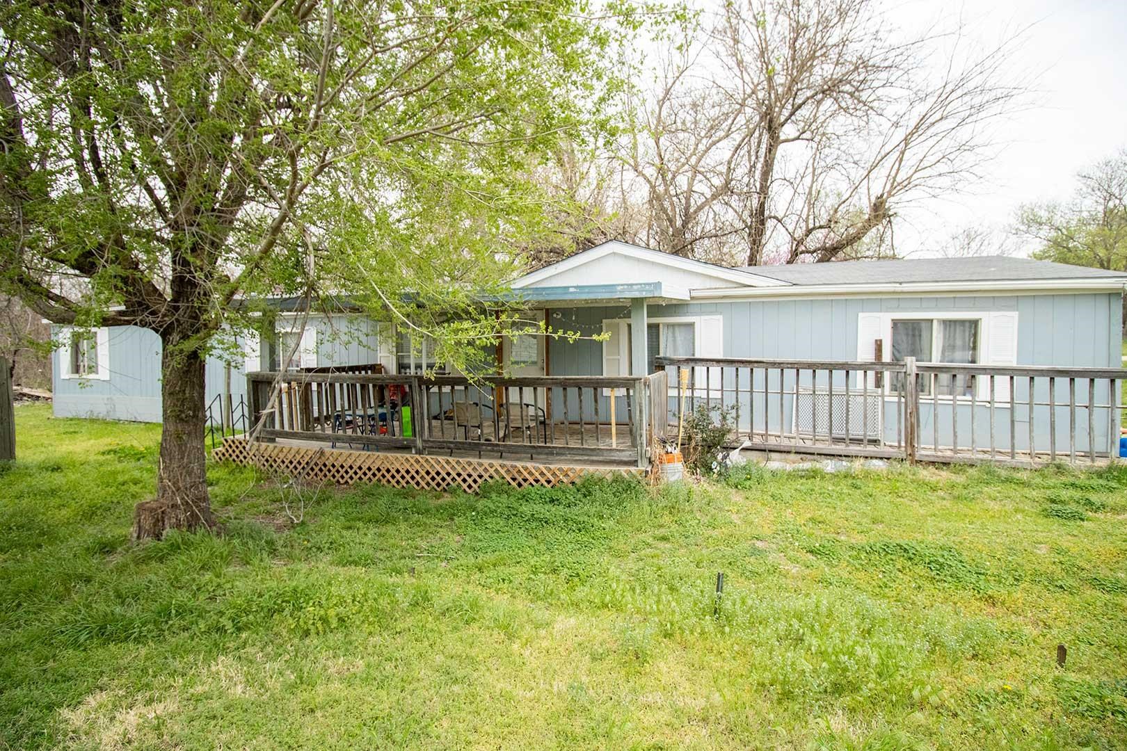 3-bedroom, 2-bathroom home located in southeast Wichita with Derby schools! The exterior features a 