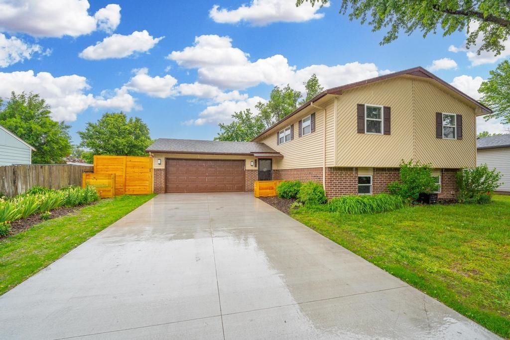 Welcome to this recently updated, four-bedroom, three-bathroom bi-level home, located near I-235 & W