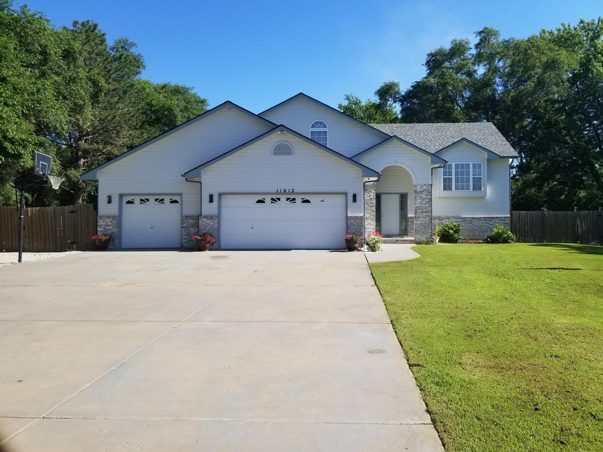 Almost 1 acre, 5 bedroom 3 bath home is located on a great oversized wooded lot. 3 car garage oversi