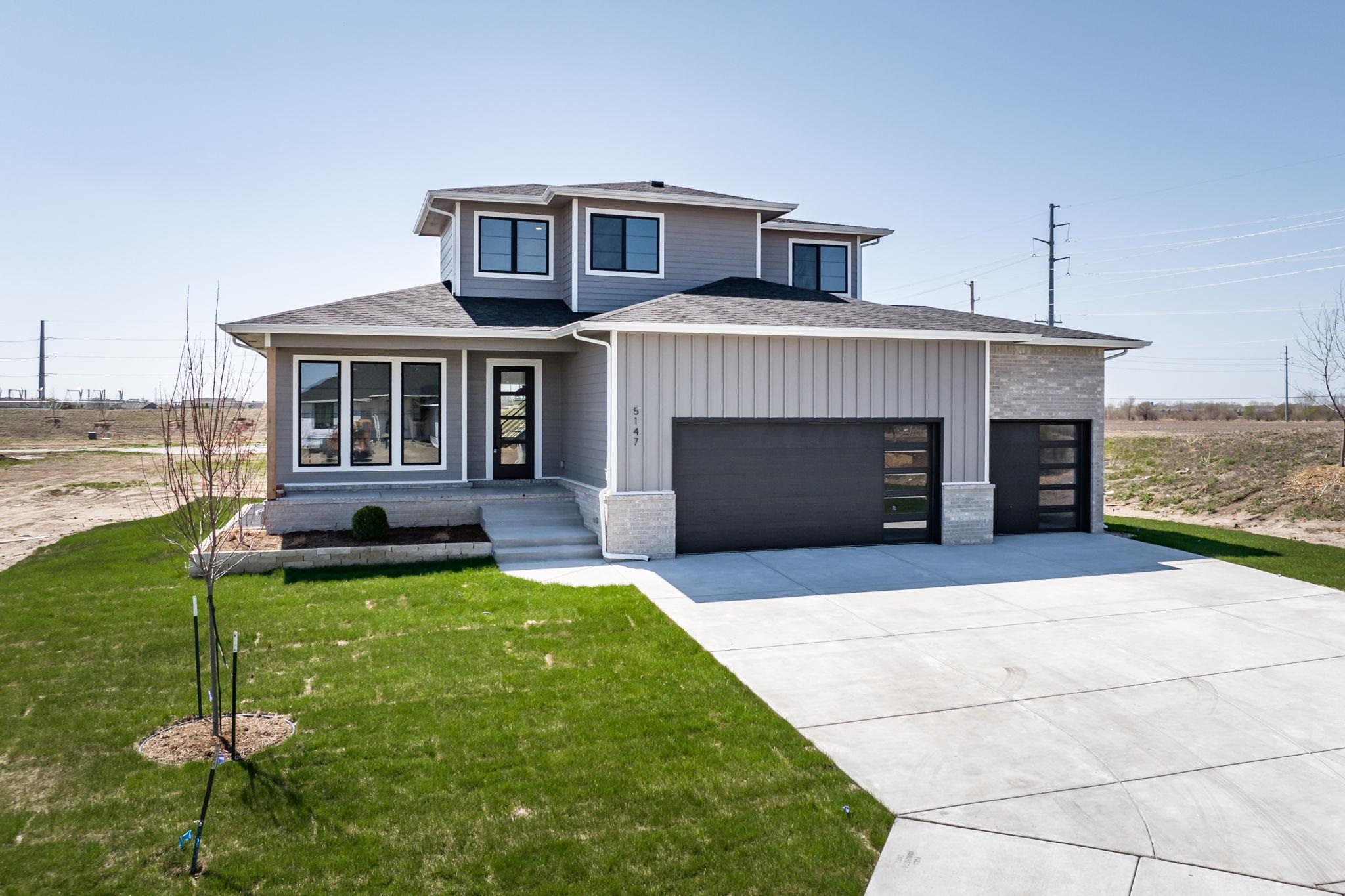 Artistic Builders brings a lovely spacious 2 story home to The Coves.  Offering spacious square feet on the main floor with open concept and beautiful Modern design.