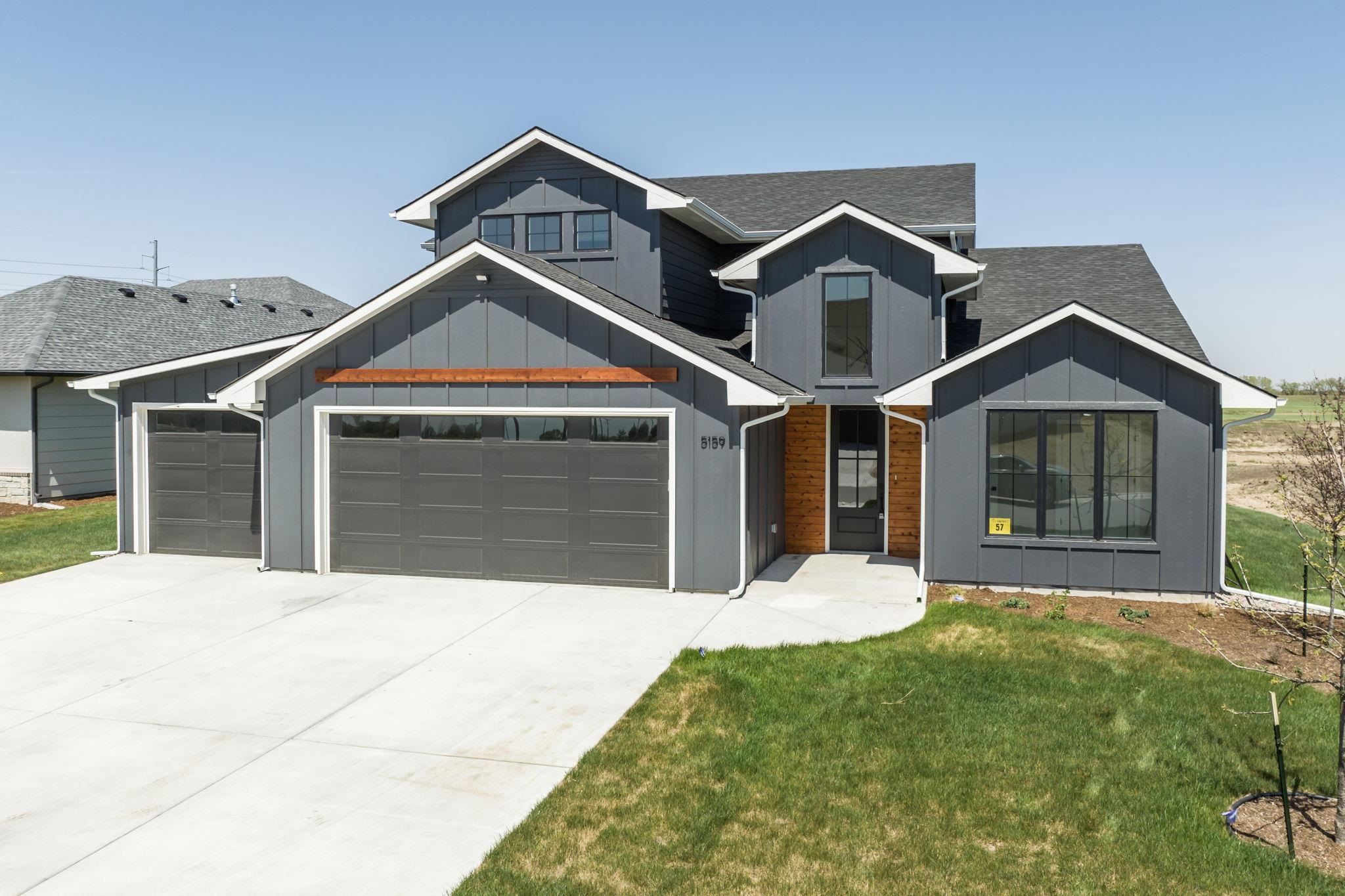 Artistic Builders brings a fabulous 2 Story Patio Home to The Coves. Beautiful Black windows and Modern design.