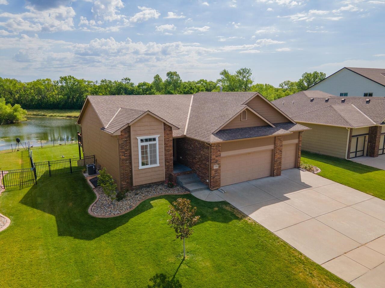 Welcome home to this move-in-ready ranch with breathtaking pond views from almost every window! This