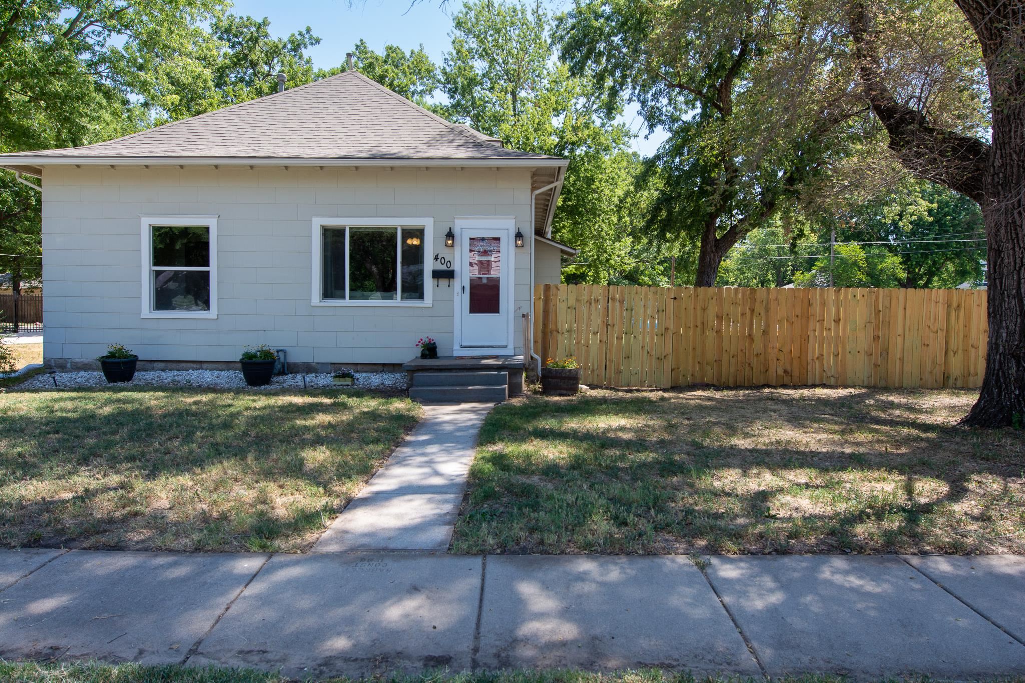 Charming and cozy this cute bungalow makes a great starter home and is move in ready.  New wooden fe