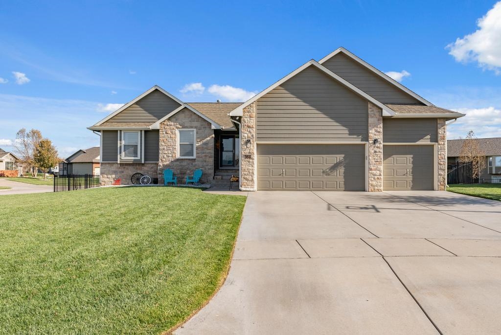 Welcome home to Hampton Lakes and this beautiful home sitting on a large corner, cul-de-sac lot! As you arrive you will first notice that Hampton Lakes sits just at the outside of Wichita in Maize. You are minutes away from New Market Square and can enjoy the "outskirts" feel of the community.  This home offers fabulous curb appeal with a long drive, rock island with landscaping, adorable space for relaxing in the front yard, glass basketball goal, gabled high impact upgraded roof with Smart Lap Siding. When you enter the home you will simply love the wood entry accent wall. The living room gives large window for natural lighting, vaulted ceiling and an open design to the dining and kitchen. The living room, kitchen, dining room and hall feature LVP flooring.  In the kitchen you will find stainless steel appliances, tons of cabinets for storage, long counter tops for prepping, space above the the cabinets that is ideal for decorating. There are 3 bedrooms on the main floor just adorably decorated with accent colors. The master suite offers a wood accent wall, a master bath offering double vanities and plant shelf. Entertain in the finished basement with an awesome walk around wet bar with wine rack, gas corner fireplace, space for a pool table, view out windows and recessed lighting. Wait until you see the backyard! You will be able to enjoy evenings relaxing on the covered deck or on the concrete patio. There is wrought iron fencing and a storage shed. The home features an irrigation well and sprinkler system. The pool table in the family room is negotiable and for sale. Ask for details.  Some information is estimated and cannot be guaranteed.