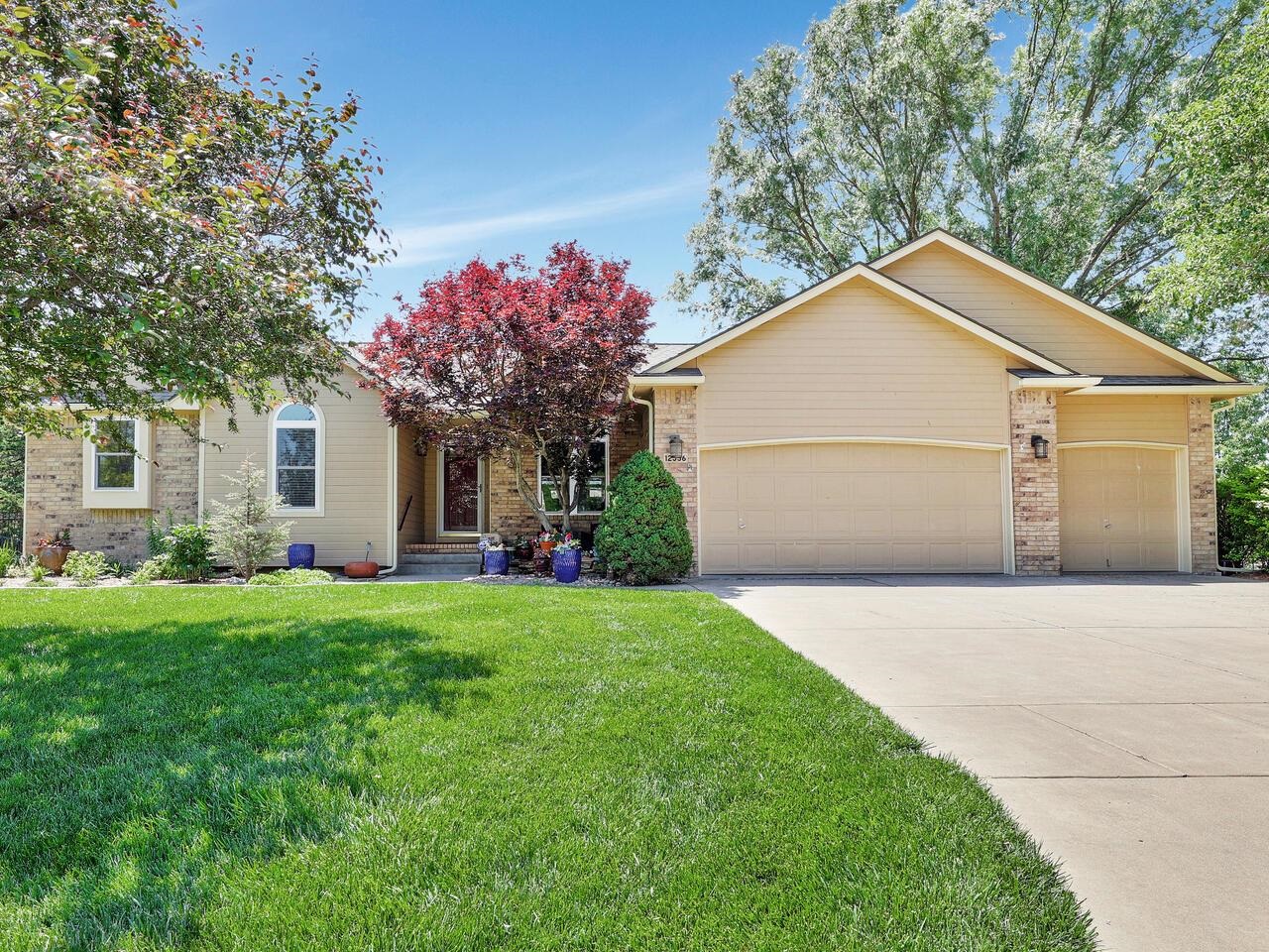 Upgrades galore!!!  Beautiful home with Light & Bright Living Room open to the Formal Dining.  Nice 3/4" Solid Hdwd floors flow into the Remodeled Kitchen.  Gorgeous Granite with Subway Tile backsplash, Stainless Steel appliances, Bosch dishwasher, Electrolux Convection oven with 2nd bottom door oven & Induction Cooktop.  Island eating bar, bayed dining area with plenty of windows, & 2-way gas fireplace.  Main flr laundry just off the kitchen.  Spacious Master Suite contains barn doors leading to the walk-in closet and the totally re-done Master Bathroom featuring custom oversized shower with body jets, 2 shower heads, & marble ledge.  Marble vanity with 2 sinks, shiplap accent wall & skylight.  Completing the main floor are two additional bedrooms & bath.  Viewout Lower Level Rec Room highlight includes Wet Bar Kitchenette with an Exquisite solid slab of Walnut with live edge bar top & matching shelves from Elderslie Farm.  Glo-Warm in basement makes the rec room extra cozy.  Full hall bath also has granite counters.  Bedroom #4 is nice-sized and Bedroom #5 doesn't have a closet but can serve many purposes - craft room, exercise room, home office & more.  Newer windows throughout, Concrete storm shelter, new light fixtures on the main floor & more.  Attractive landscaping & garden ready for harvest.  Enjoy the wrought-iron fenced backyard from the patio or the deck with composite overlay deck flooring & iron railing.  Updated & maintained ---- you won't want to miss this one!