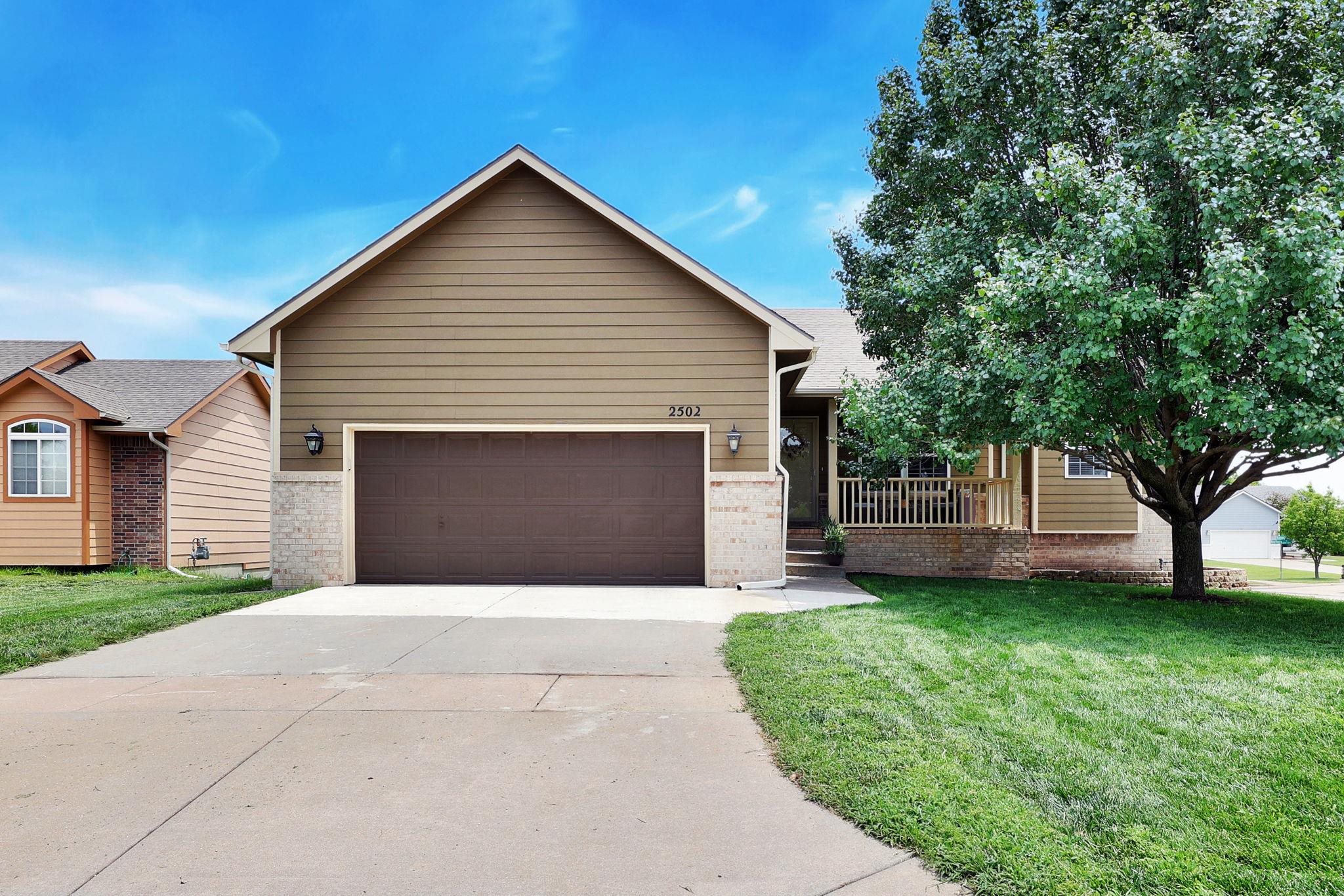 Open Split Bdrm Ranch with Nice Street Appeal & Covered Porch.  Featuring 5BR, 3BA this home is situated on a corner lot in desirable Fairmont Addition located in NE Wichita.  Vaulted Ceilings & Living Room WBFP.  Kitchen Showcases a Large Island with Lowered Eating Bar and Solid Surface Top, Gas Range, Wood Laminate Flooring, Dining Area, & All Appliances Remain - including the Main Floor Washer & Dryer.  Nice-sized rooms throughout with Master Ensuite with Walk-In Closet, Two Sinks, & Corner Tub with Separate Shower.  Viewout LL contains a Spacious Rec Room & Dry Bar, 2 Bedrooms, Full Bath, & Large Storage Space.  Upper Level Deck is great for Entertaining.  Minutes away from Shopping, Entertainment, & More this is Conveniently located.