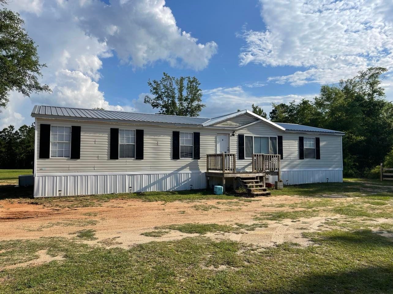Rare find! Out in the country in Gadsden County! This is 3/2 DW MH - move in ready! New metal roof (2 years) & new septic and well (3 years), home is fairly new (2019).  2.06 acres, move in ready!
