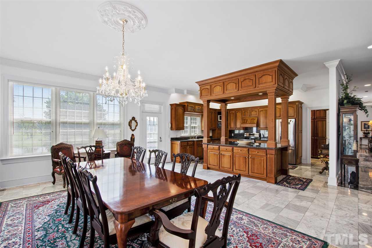 Large kitchen with marble floor opens to large breakfast room. Located behind main kitchen is a second butler's kitchen and scullery.