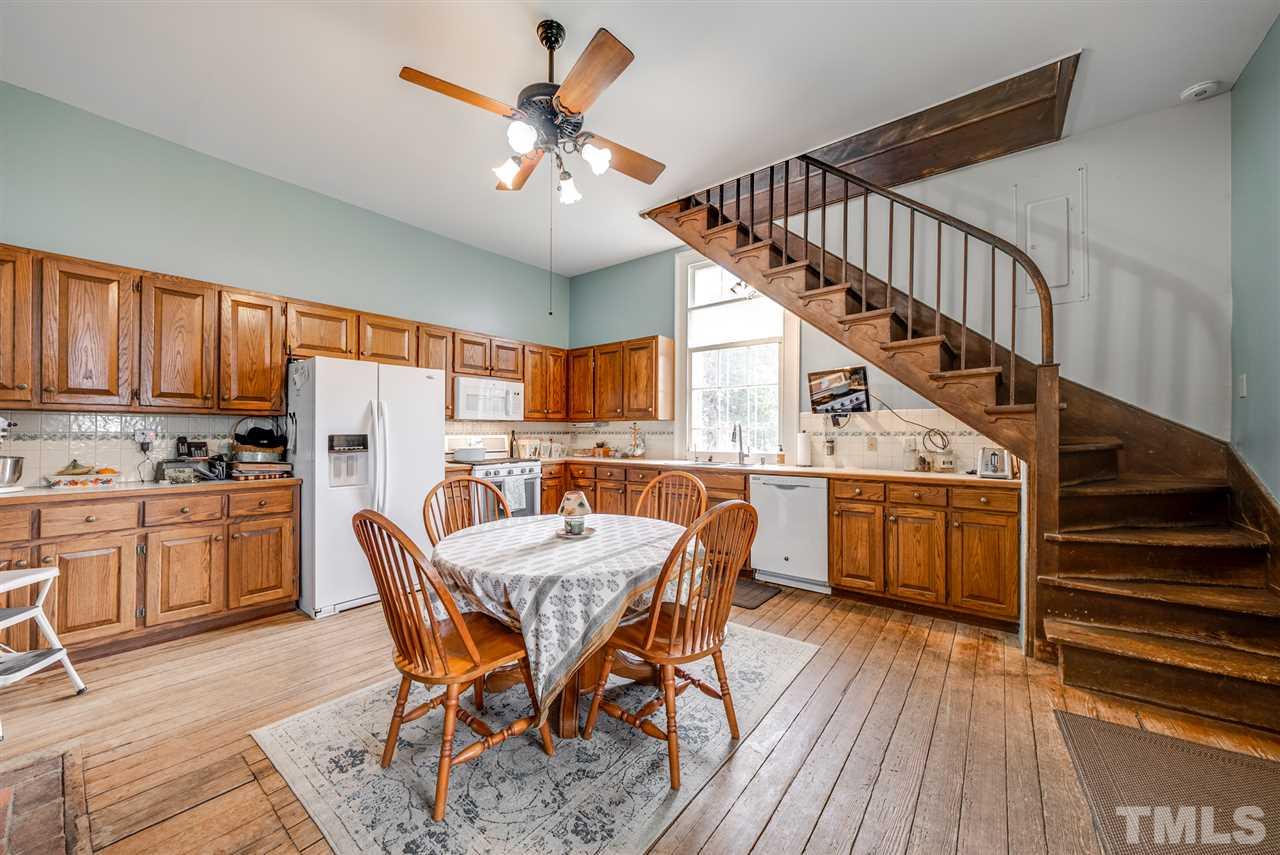 The kitchen in the main home has it own fireplace and separate stairway.