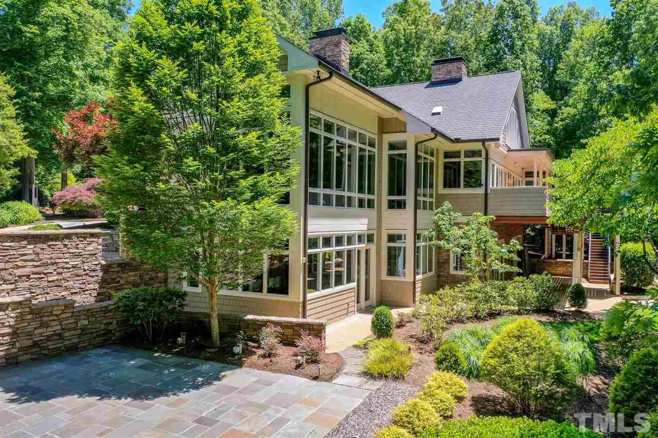 From its inception and architectural vision, the home was skillfully oriented on the property so that every main and lower-level room, as well as the decks and terraces, share commanding views of the woodlands.