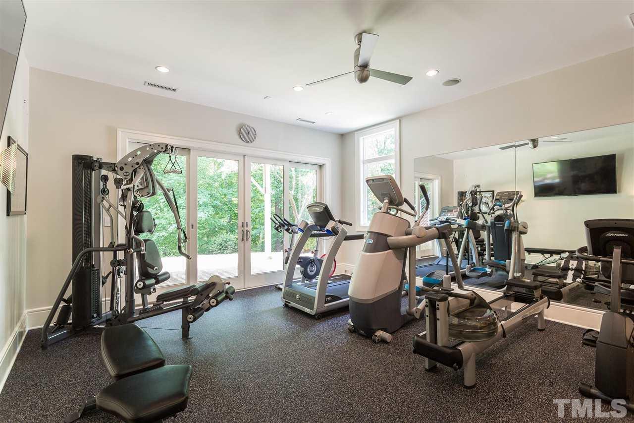 Imagine the health benefits of working out in a home gym that can be open to the great outdoors so you can seamlessly integrate your indoor and outdoor workouts. The gym offers 10-ft ceilings, non-skid padded flooring, mirrors on 2 walls, and ceiling fan.