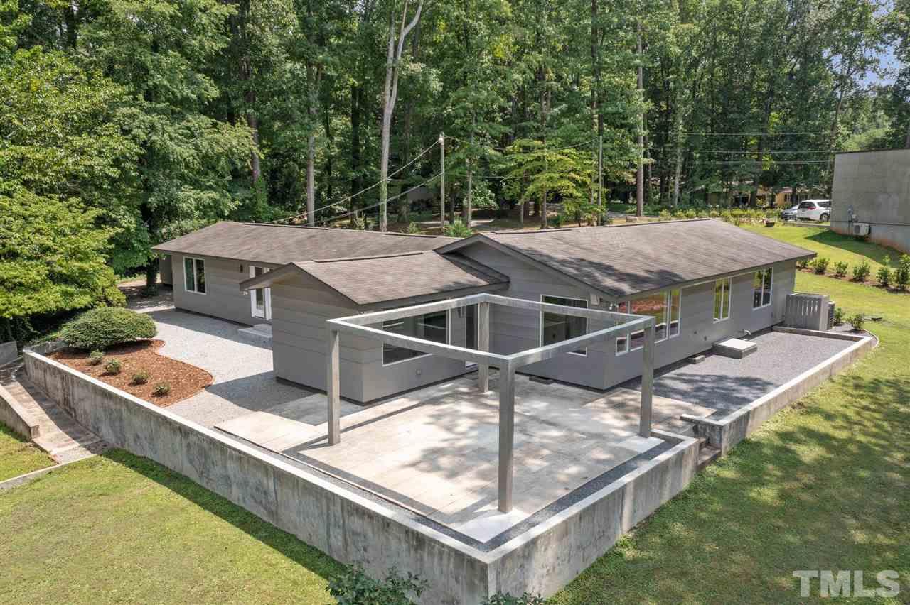 This beautiful mid-century modern lakefront home has been meticulously remodeled from the ground up with a true modernist design. Trimless doors & windows accentuate the clean design, vaulted ceilings, and warm oak hardwoods. Top-of-the-line insulated Pella picture windows provide lake views from every room and natural light from dusk to dawn. This is truly a one of a kind home with details including dark quartz countertops, custom concrete exterior, and the open patio overlooking the lake. No city taxes!