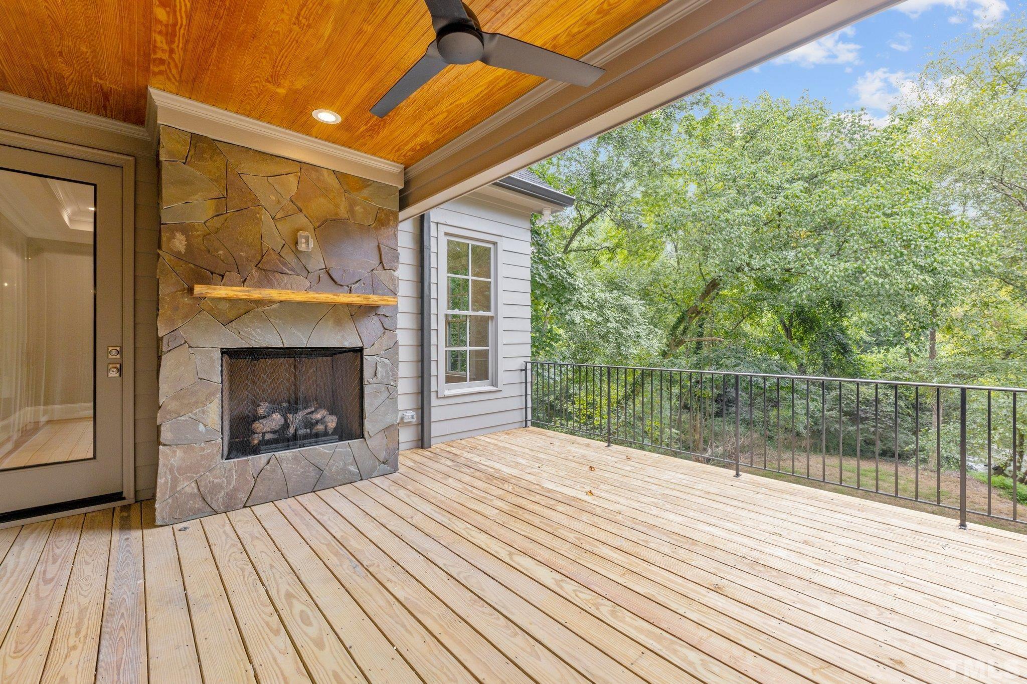 Enjoy the partially covered back porch just off the great room and master bedroom. Featuring a natural stone gas fireplace to keep you warm during the cooler Carolina seasons.