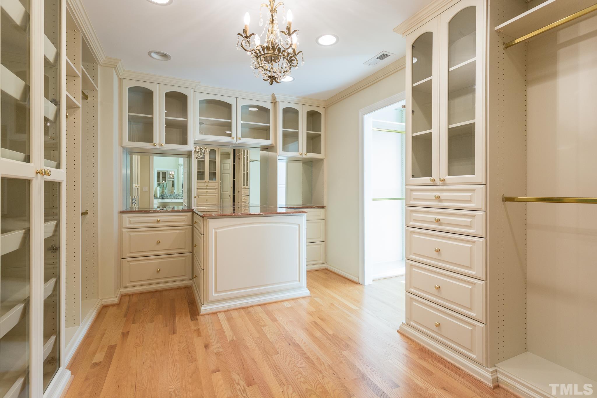 The two walk-in closets in the owner???s suite are exemplary and filled with exquisite custom details.