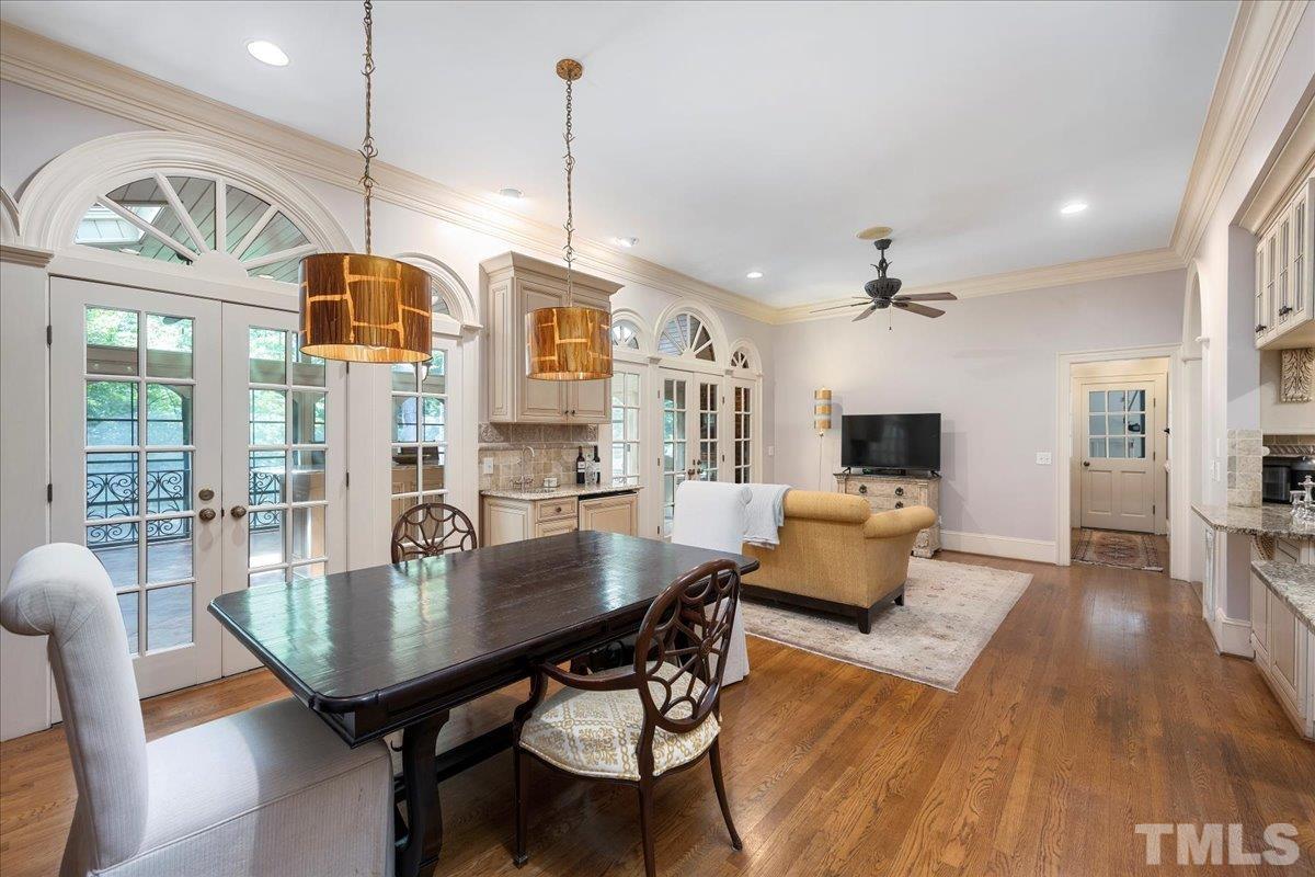 Breakfast Area and Keeping Room off Kitchen with Hardwood Floors, Wet Bar, Arched Doorways and Extensive Crown Molding