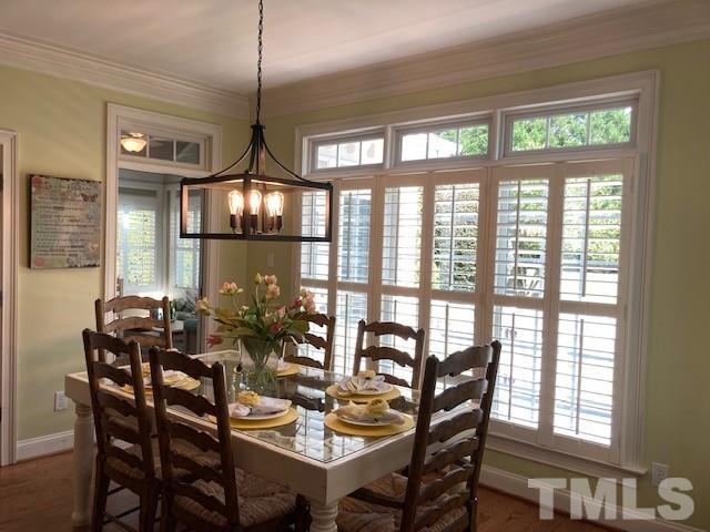 Adjacent light filled breakfast nook has views of the beautiful backyard and is large enough to gather plus plenty of room at the breakfast bar for more guests.  Plantation shutters.