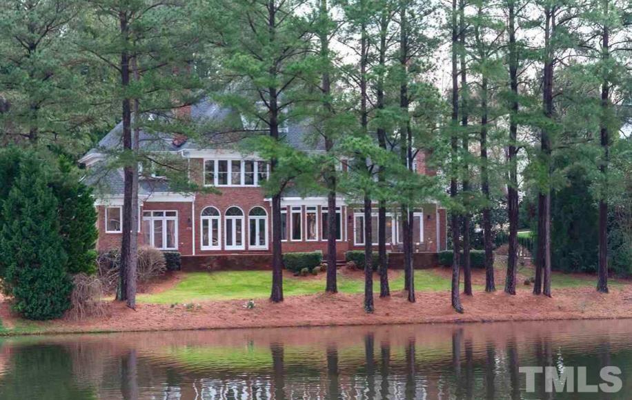Three story, all brick beauty with a gorgeous lake views, w/lighted water fountain and gazebo. All this is maintained by the HOA.