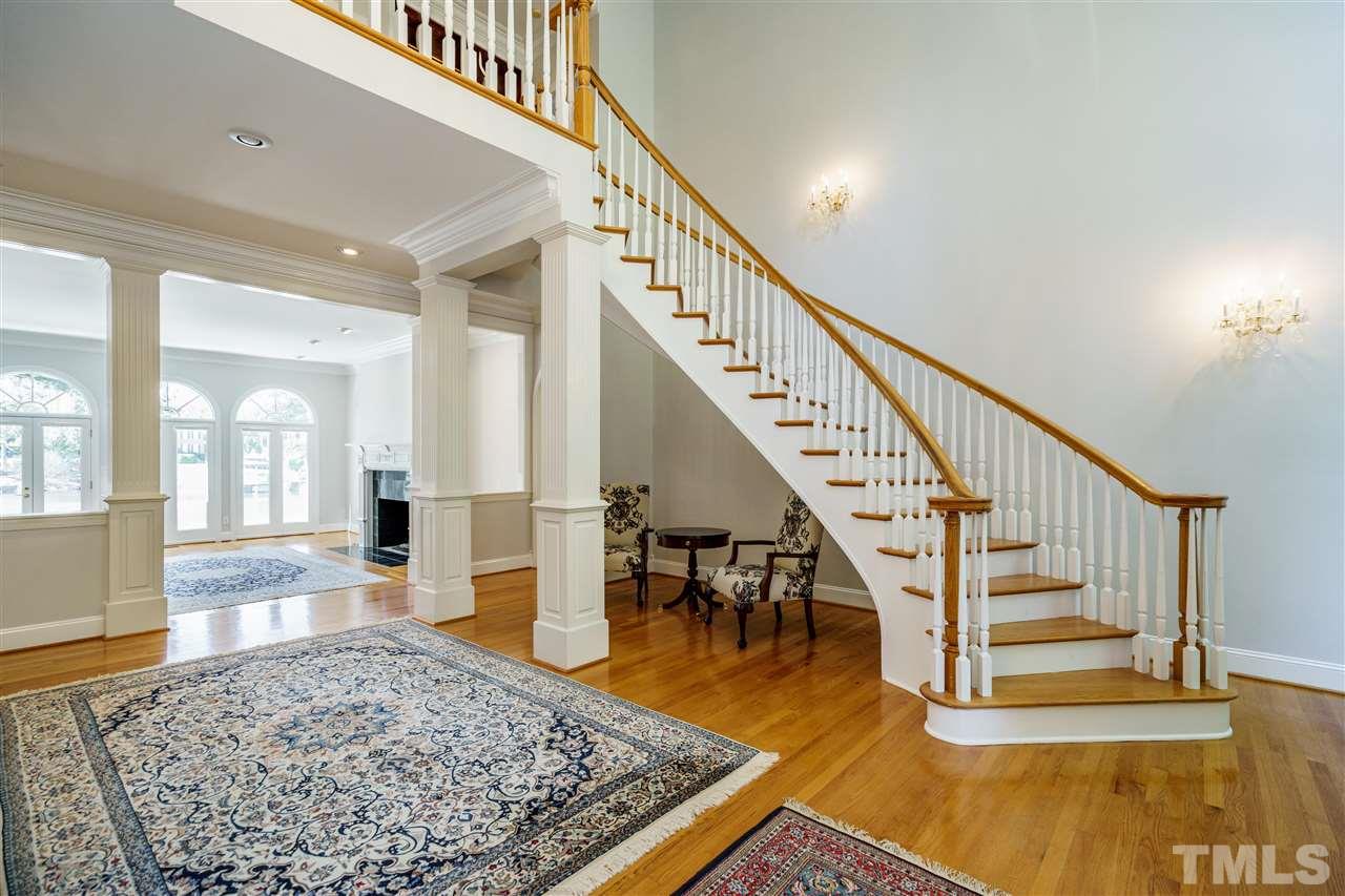 Three story foyer with stunning views of the lake.