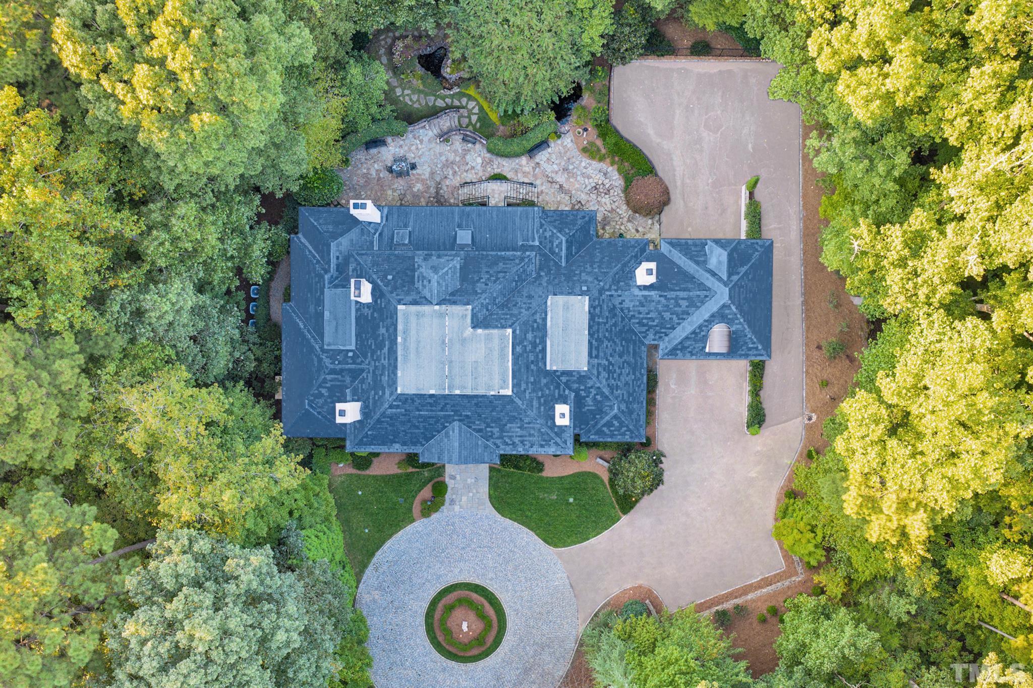 Breathtaking aerial view showing the privacy the owners have. Community swimming pool, basketball court, and playground for kids, and 40 acres of protected lands. Costs $5.5M to custom build in 2007/2008