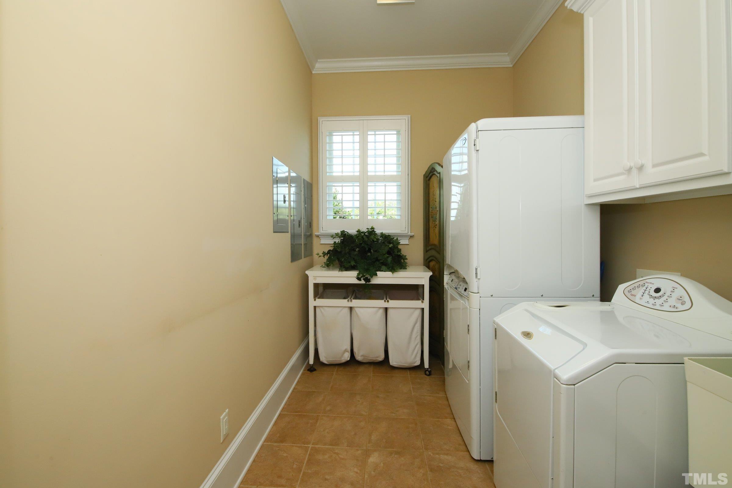 Extremely spacious making laundry time a breeze. Features storage and laundry sink.