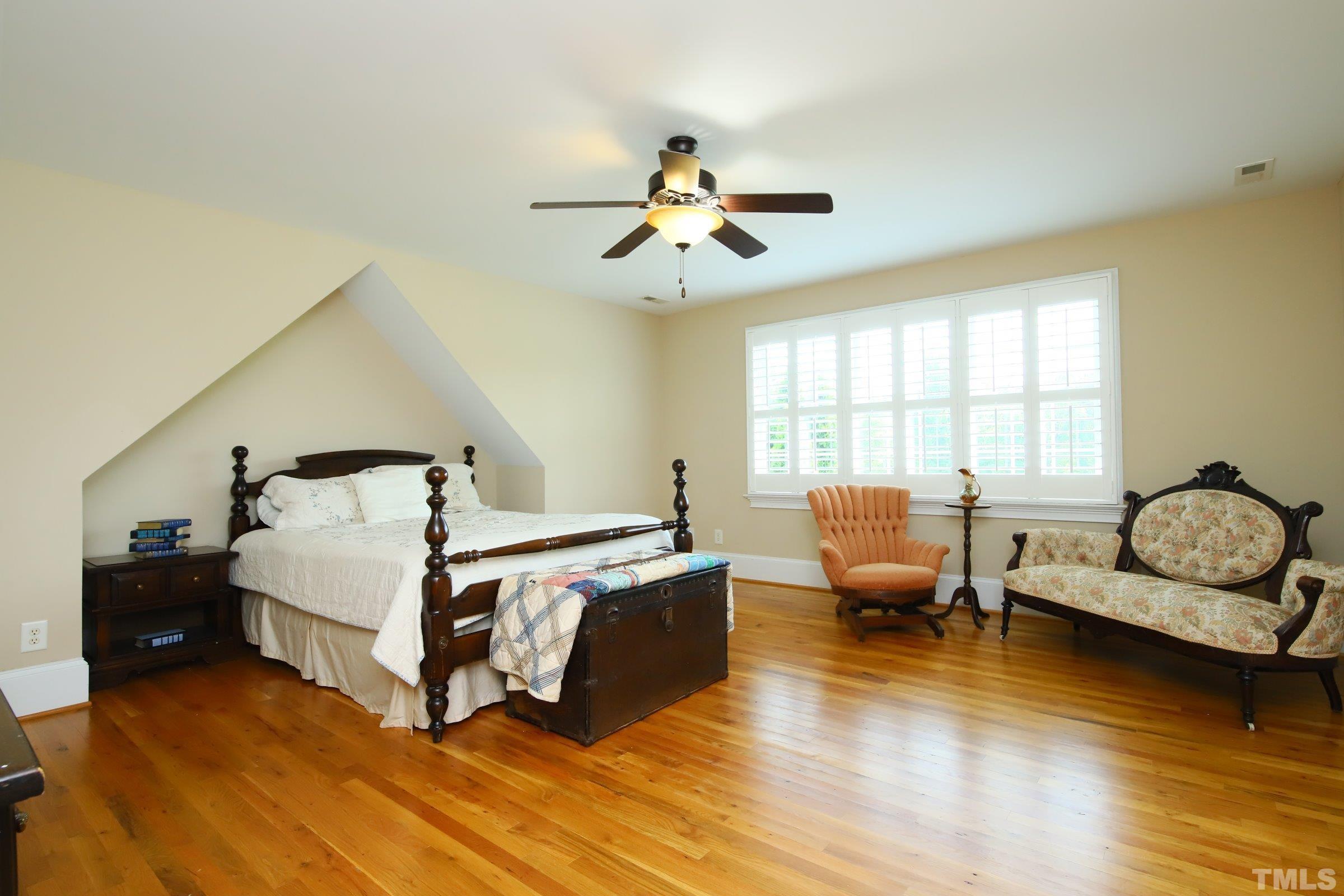 Beautiful room with cozy nook, large walk-in closet and attic storage access.