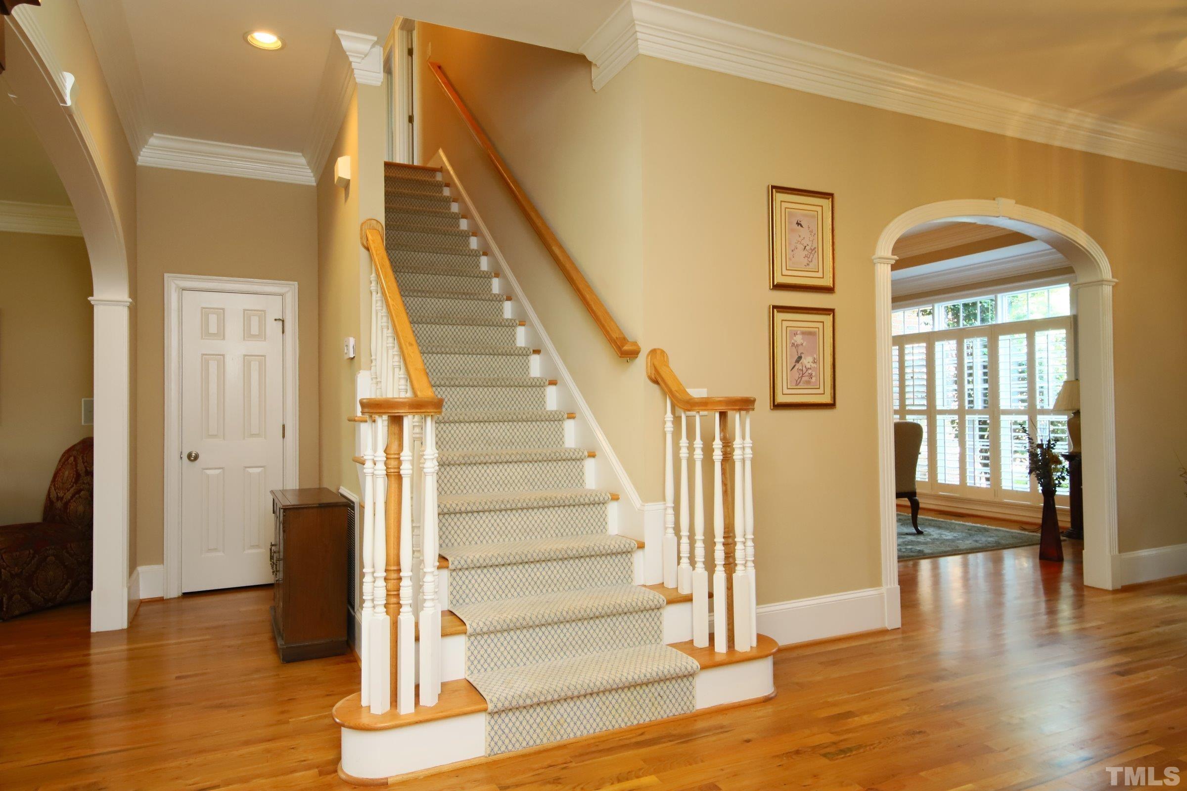 Gracious stairs lead to second level of volumes of space for living, sleeping, exercising......whatever is needed at this grand estate.