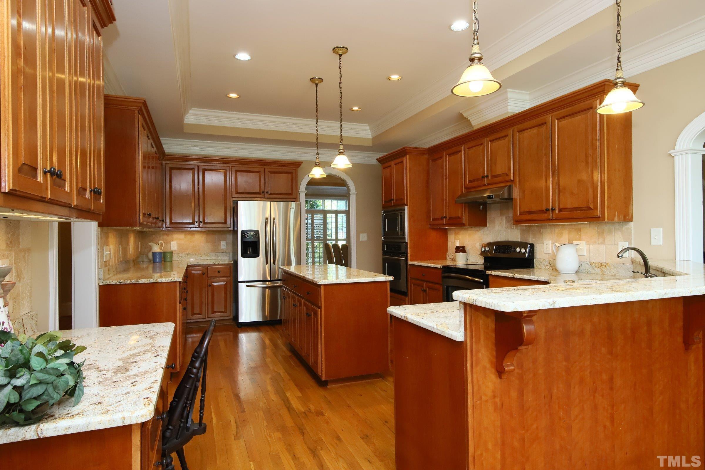 What a kitchen! Room for all the culinary artists with two ovens and yards of countertop space.