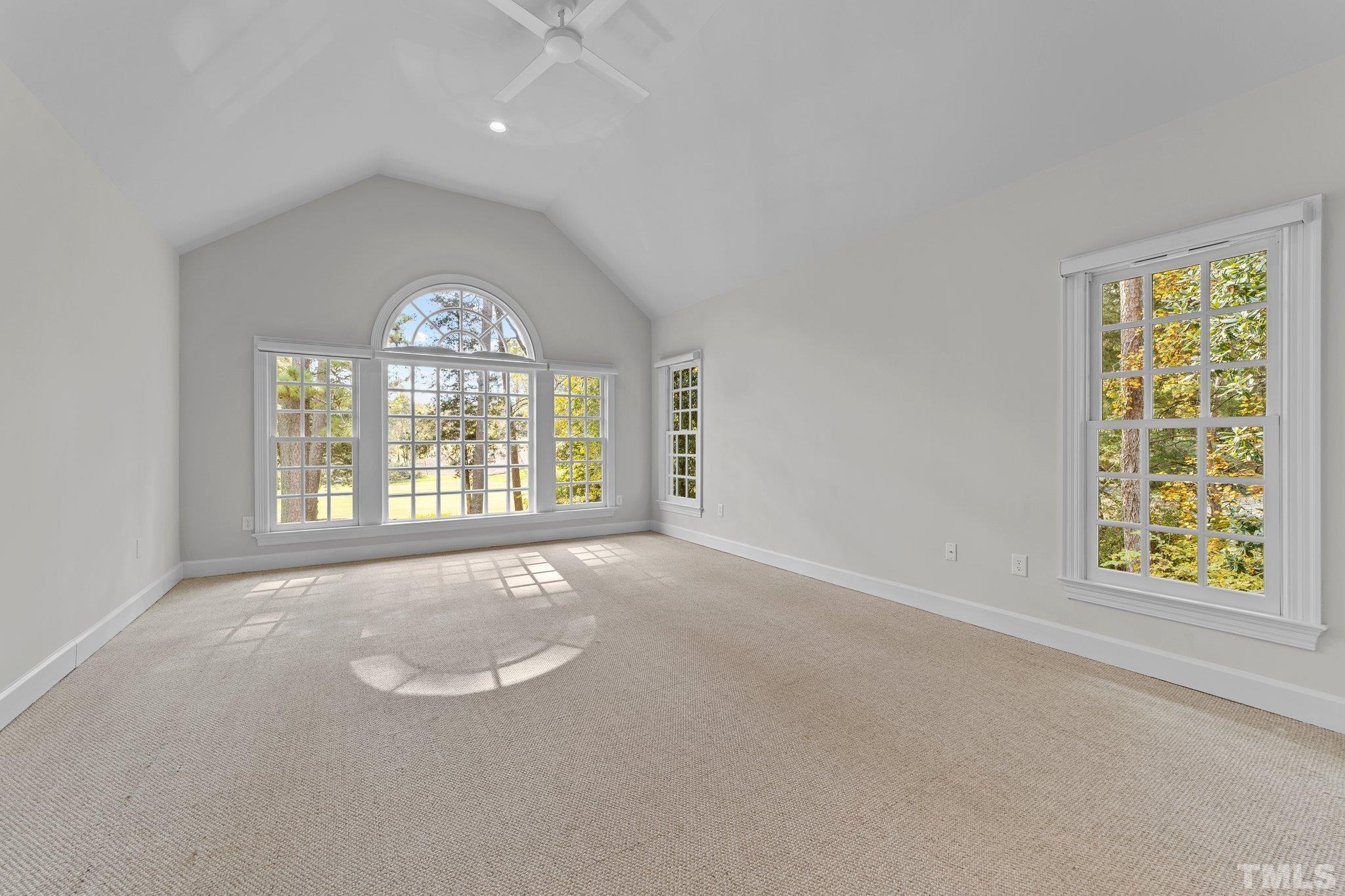 Wonderful vaulted ceiling and gorgeous large windows! Spectacular views of the gardens below and the golf course beyond.