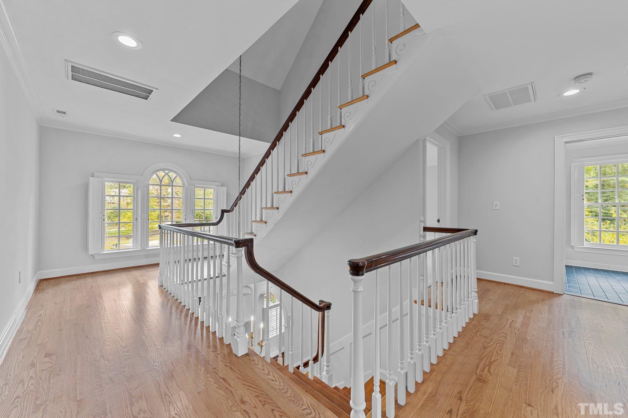 Fabulous interior stairs open to second floor bedrooms and baths and continue to 3rd floor to walk in attic plus flex space. A bonus for crafts, sewing or other quiet activity.