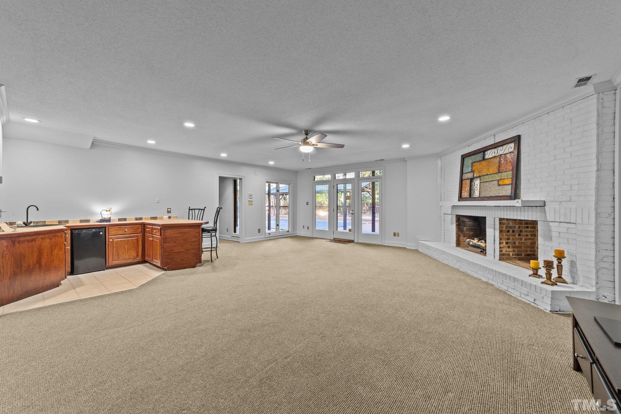 Large Family Room in Basement w/ Brick Gas Fireplace