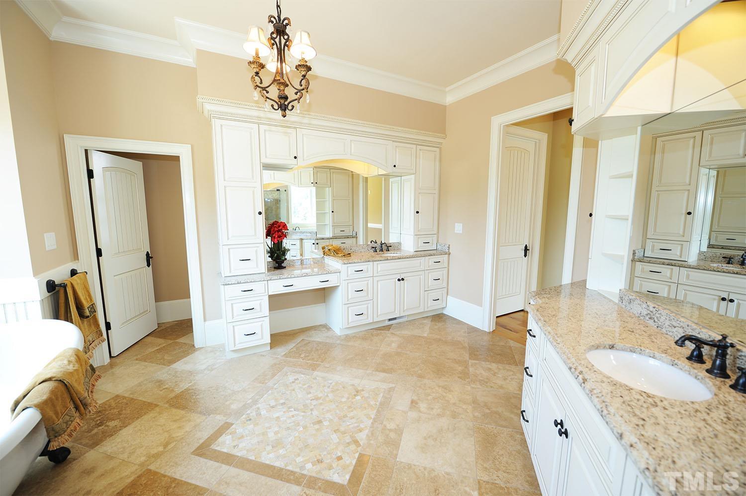 Another view of the luxury bathroom. Each of the vanities has storage above, below and on the sides.