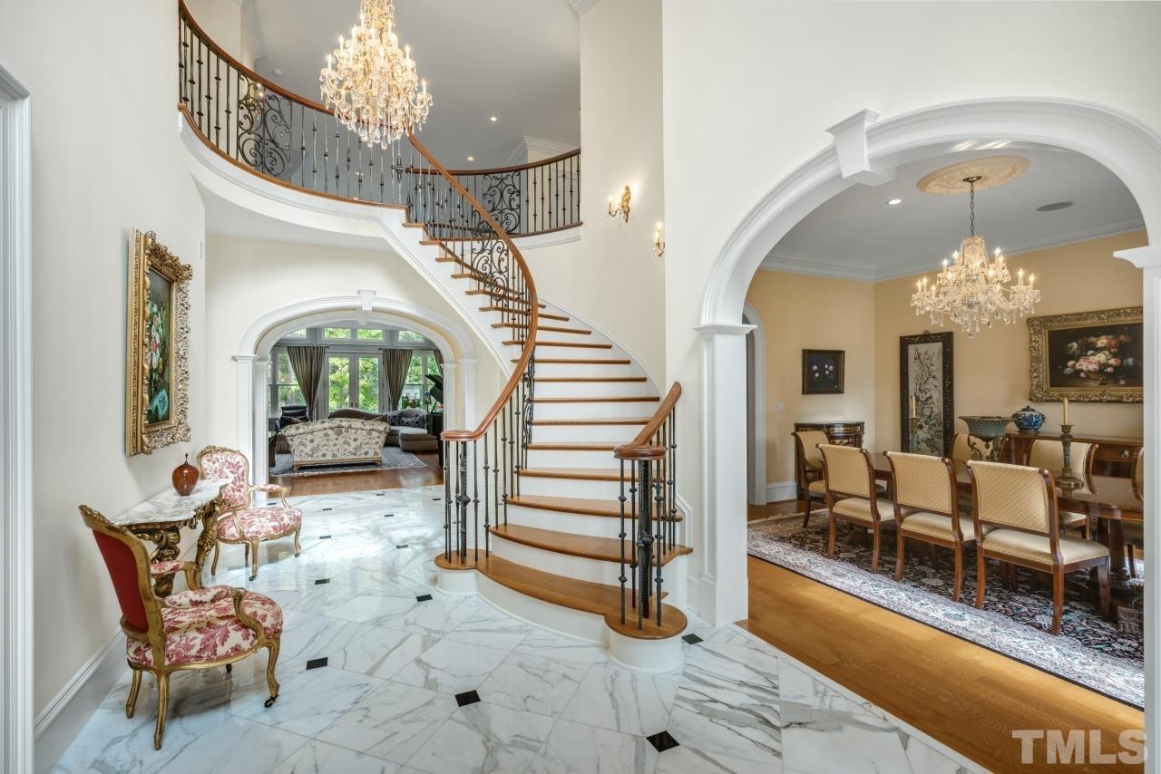 What an Entrance with a Grand 2 Story Foyer ~ Carrera Marble Floor ~ Stunning Chandeliers