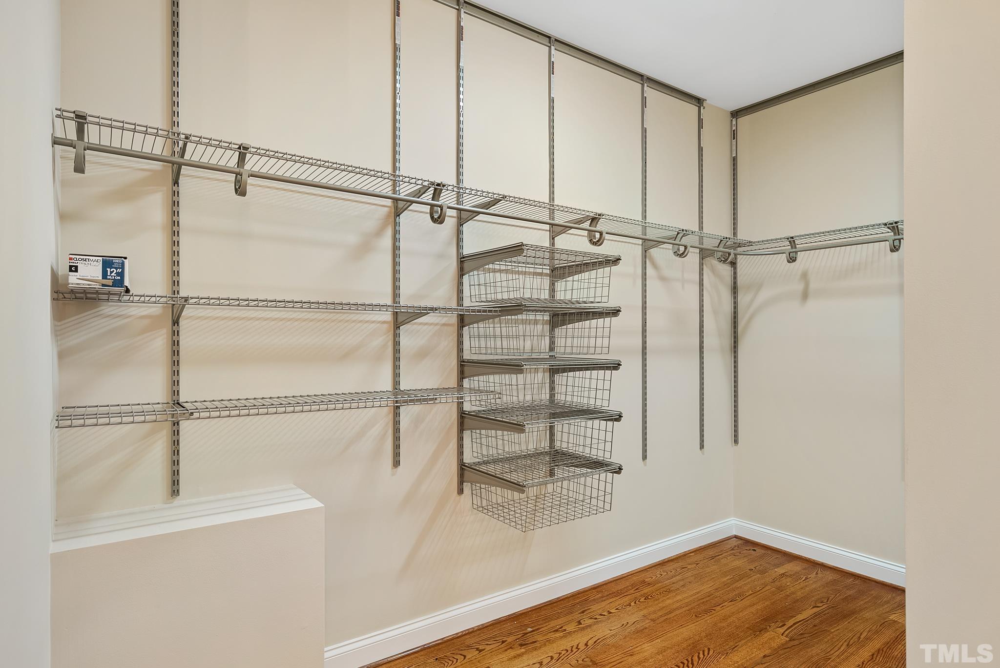 HUGE walk-in closet with dressing area and chandelier