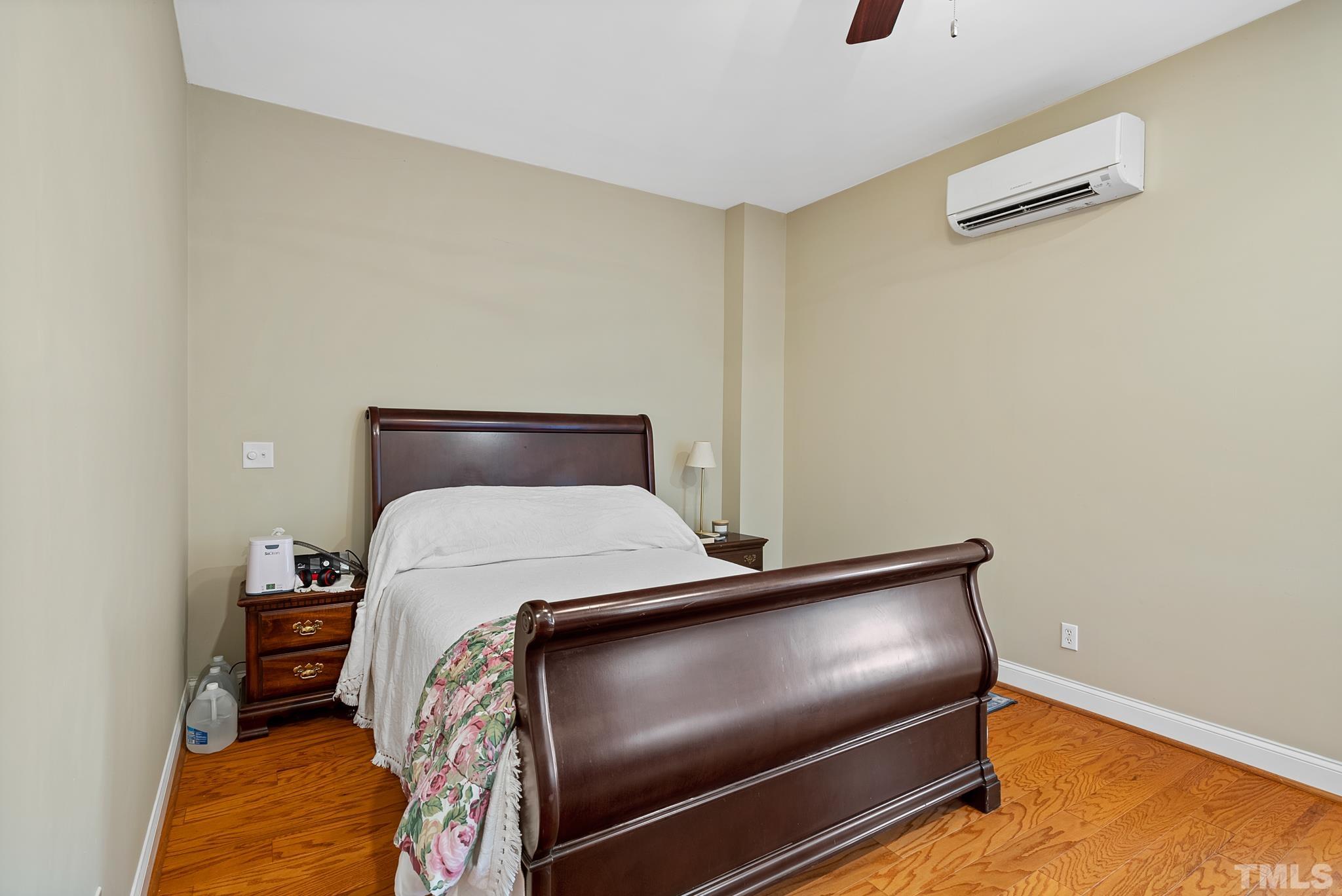 Bedroom with mini-split HVAC. Wide doorways for wheelchair accessibility