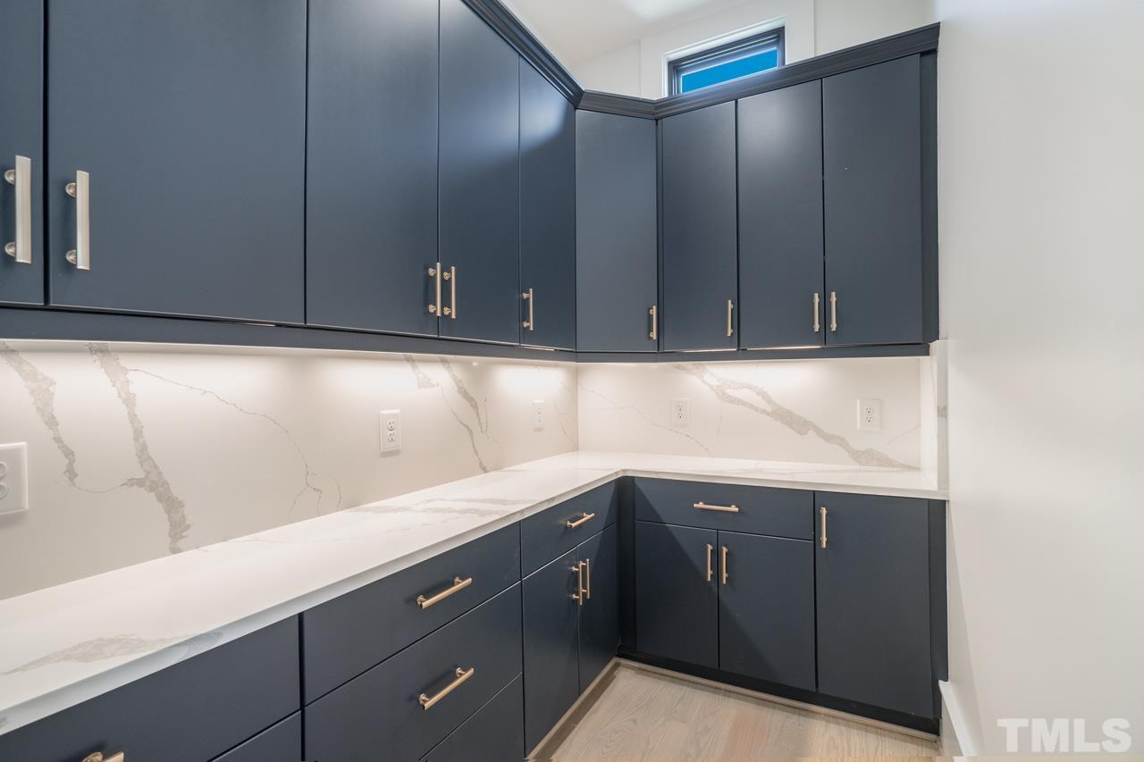 Walk-in Pantry with Custom Cabinetry and Premium Natural Quartz Countertops & Slabs