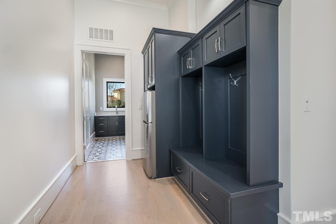 Mud Room/Hall with Refrigerator and Built in Shelves