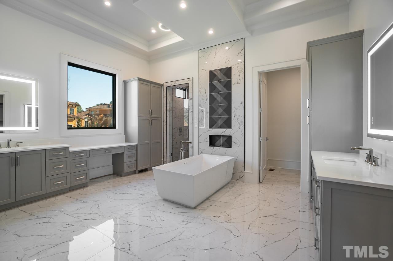 Owners Bath with Tile Floor/ Quartz Vanity Tops/ Heated Floors and Bathtub Controlled via Wifi