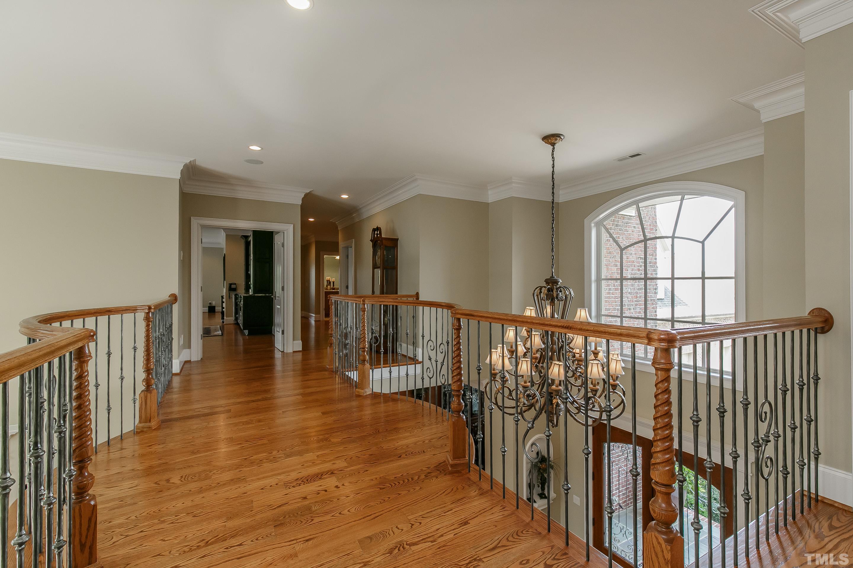 Interior balcony is ornate with stunning views of foyer and living room