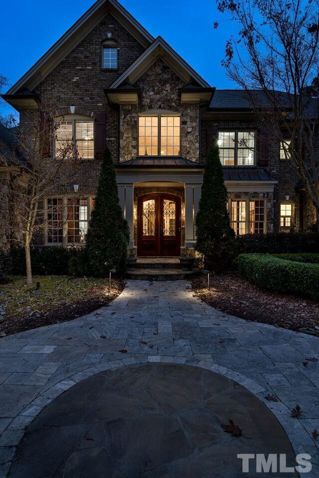 This lovely home has landscape lighting so that it is illuminated every evening.