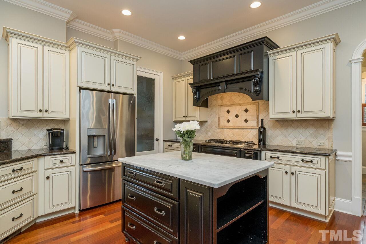 This large kitchen has abundant cabinet and counter space.