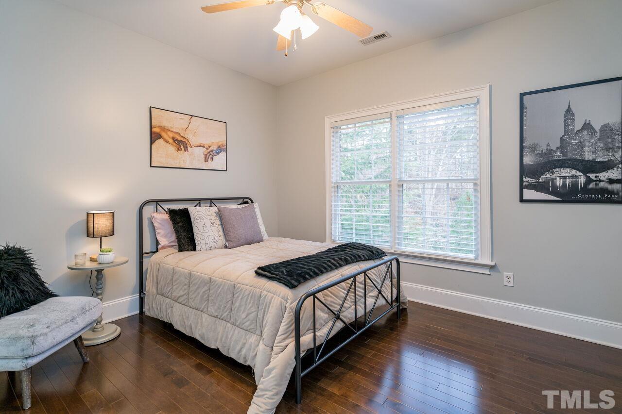 This charming bedroom is also on the second floor and has a view of the back yard.